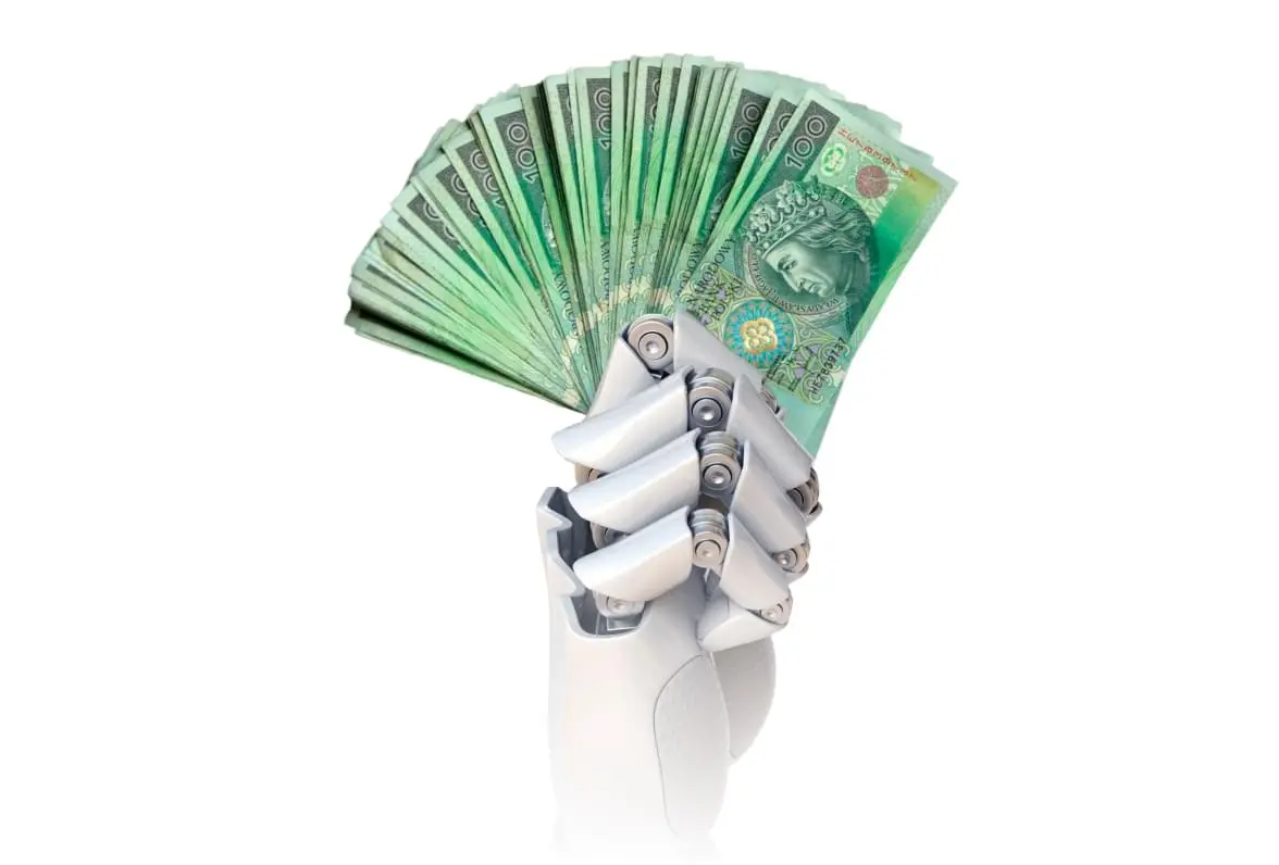Robotyczna dłoń trzymająca banknoty pieniężne